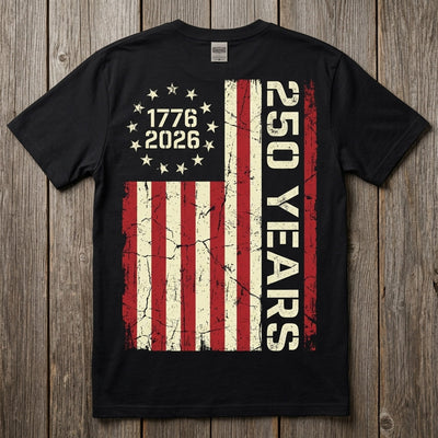 Styled flatlay showing 250 Years flag back print on black tee