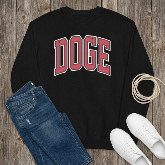Styled flatlay of black DOGE varsity sweatshirt on barnwood