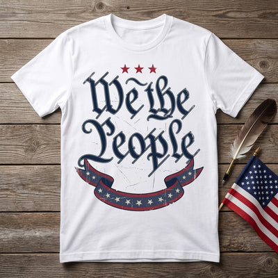 Styled flatlay of We The People white tee with quill pen