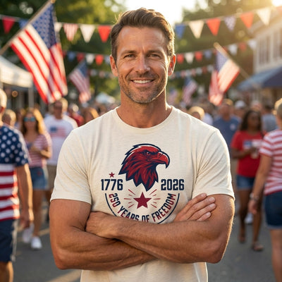 Man wearing 1776-2026 250 Years of Freedom natural tee at July 4th parade