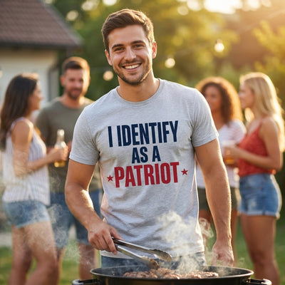 Man wearing I Identify As A Patriot heather tee at backyard barbecue