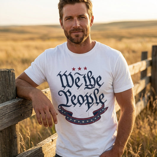 Man wearing We The People white t-shirt at ranch fence