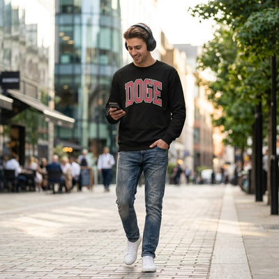 Man walking city street wearing black DOGE varsity sweatshirt