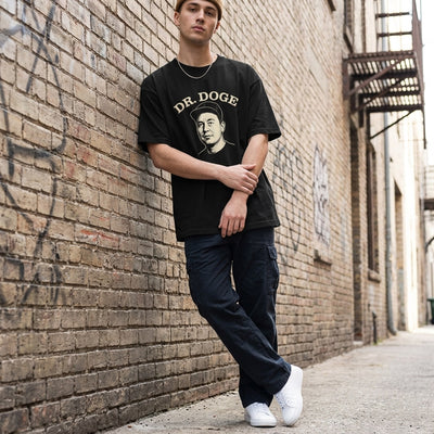 Young man in streetwear wearing Dr DOGE oversized black tee