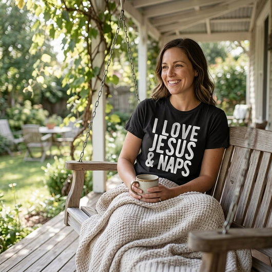 Woman relaxing on porch swing wearing I Love Jesus and Naps black tee