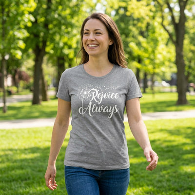 Woman walking in park wearing grey Rejoice Always t-shirt